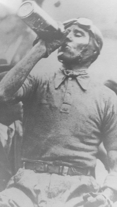 Nuvolari after winning the Targa Florio in 1931. Varzi entered a private Bugatti painted Italian red, and almost beat the entire Afla works until the rain and the mud got the better of him.